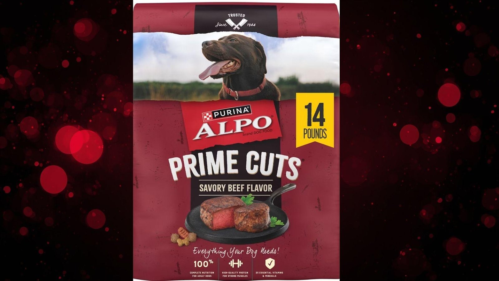 "Purina ALPO Prime Cuts Savory Beef Flavor dry dog food, 14 pound red bag with image of chocolate Labrador and cooked steak, on red bokeh background"
