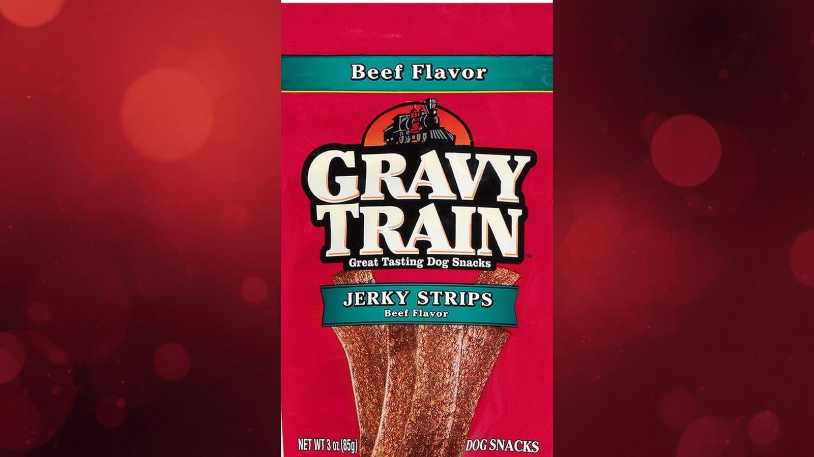 "Gravy Train Beef Flavor Jerky Strips dog snacks package on red bokeh background"