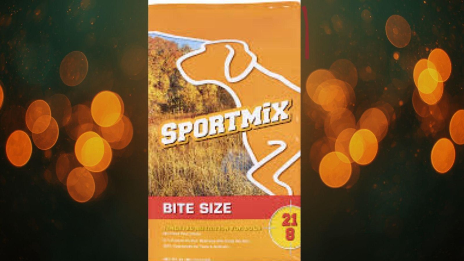"Sportmix Bite Size 21/8 formula dry dog food orange bag for active dogs on warm bokeh background"