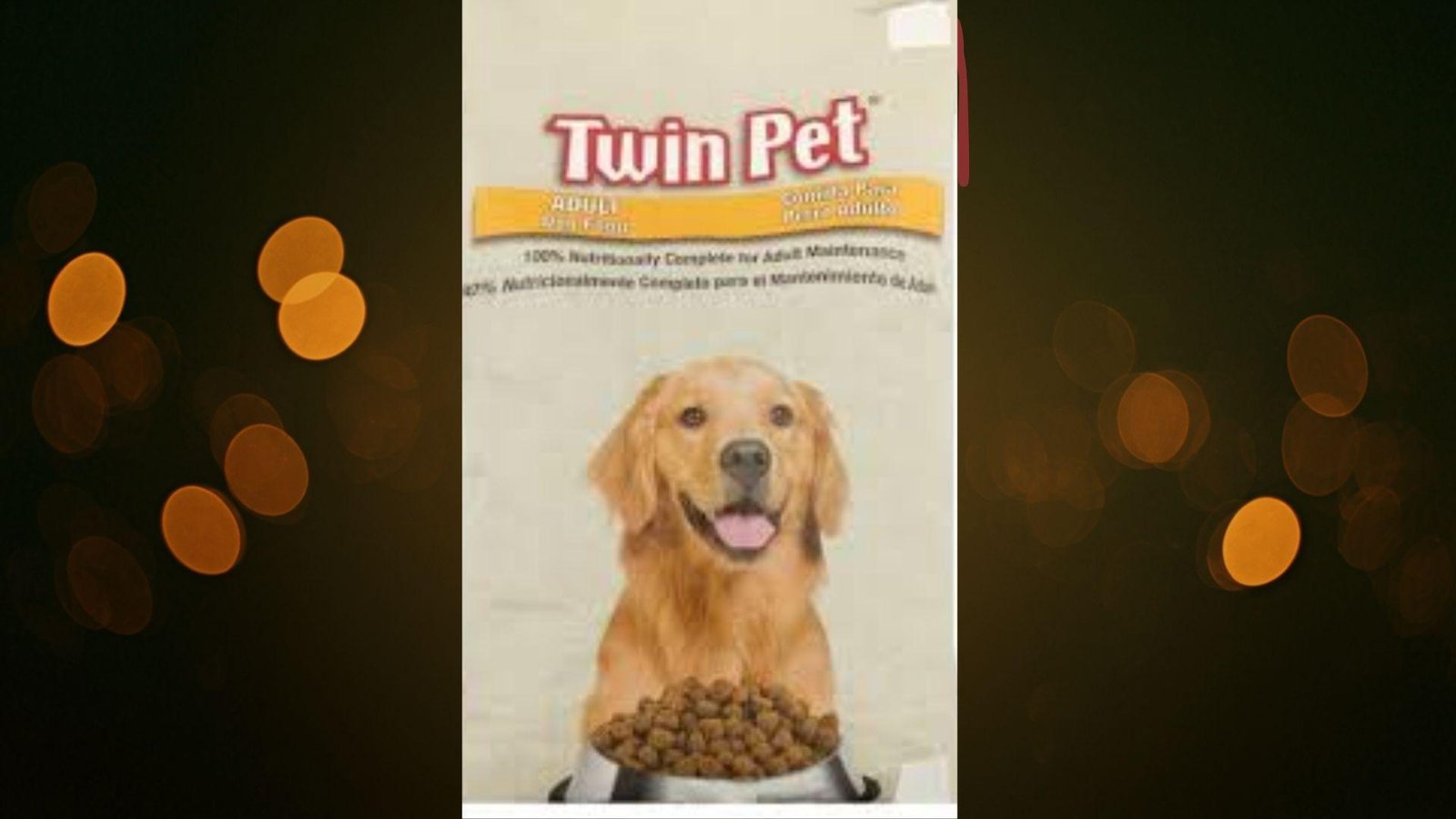 "Twin Pet Adult dog food bag with golden retriever and bowl of kibble on warm bokeh background"